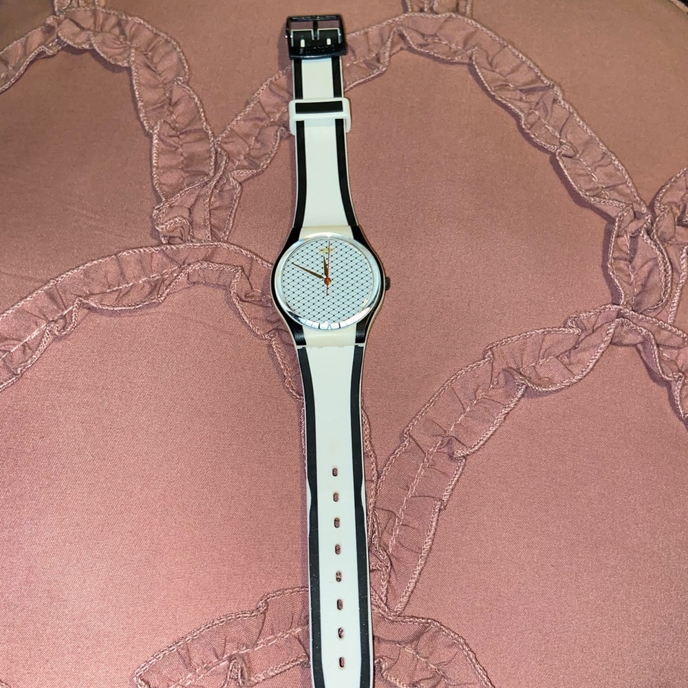 Swatch two tone black and white small face watch.
